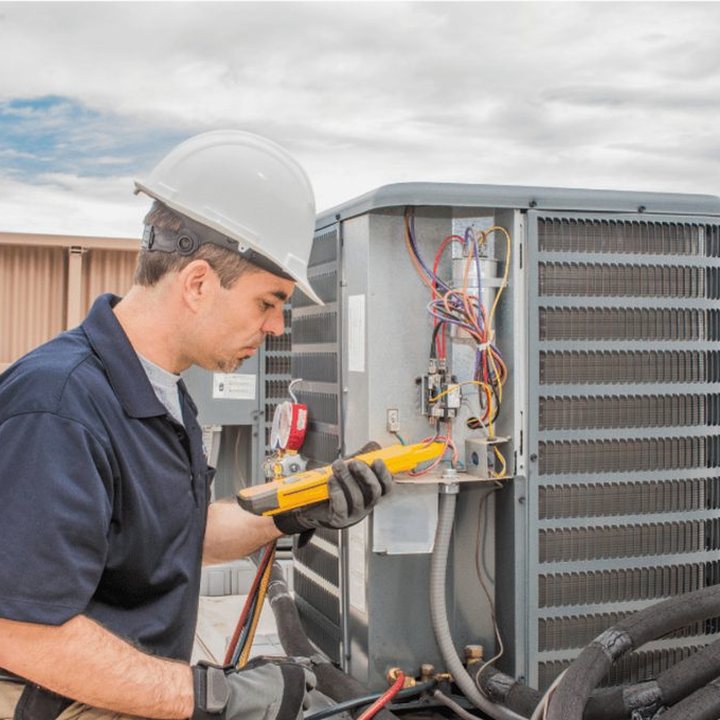 Parkhill Heating & Cooling HVAC technician on a service call in Parkhill, Ontario